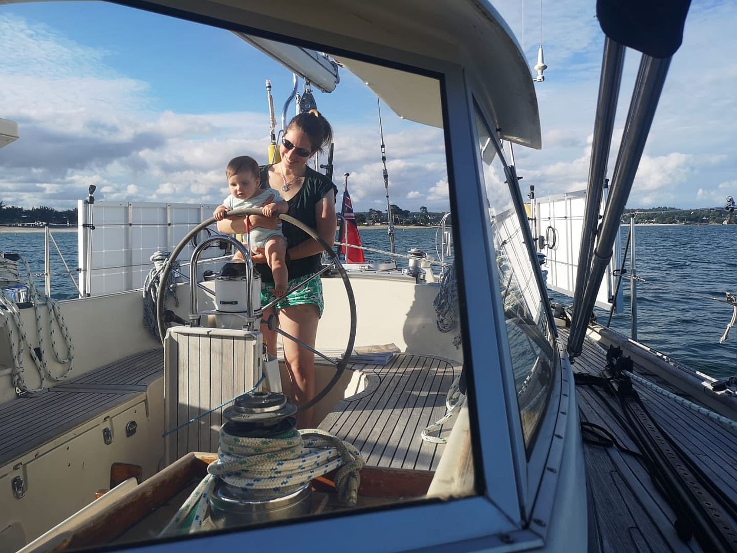 Mother sailing with baby on board, reflecting on family life afloat