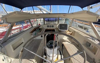 At the helm looking at the instruments in the cockpit At the helm looking at the instruments in the cockpit