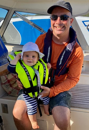 Toddler wearing a Bambi Baltic lifejacket on a sailboat Toddler wearing a Bambi Baltic lifejacket on a sailboat