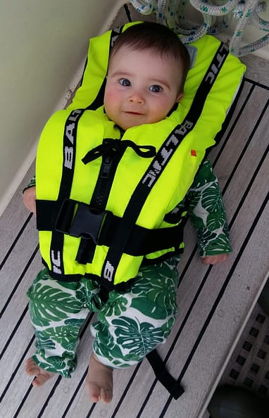 Baby wearing a Baltic 'Bambi' lifejacket buoyancy aid Baby wearing a Baltic 'Bambi' lifejacket buoyancy aid
