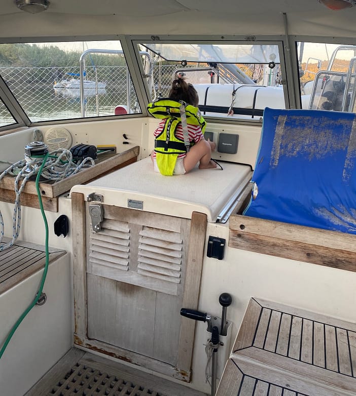 Toddler wearing her Baltic Bambi Lifejacket while sat in the cockpit of our sailboat Toddler wearing her Baltic Bambi Lifejacket while sat in the cockpit of our sailboat